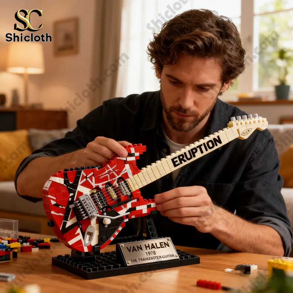Man building lego electric guitar model at home table!