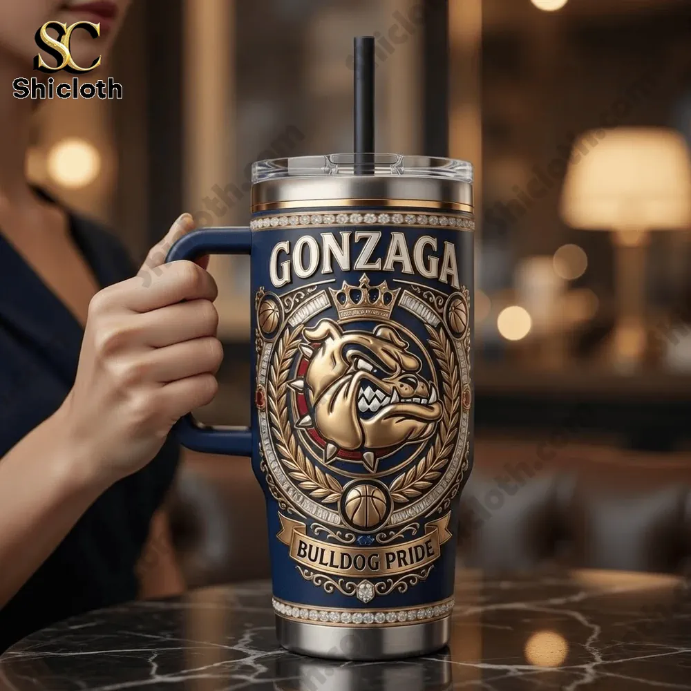 Hand holding Gonzaga Bulldog Pride tumbler with handle from Shicloth in warm cafe setting!