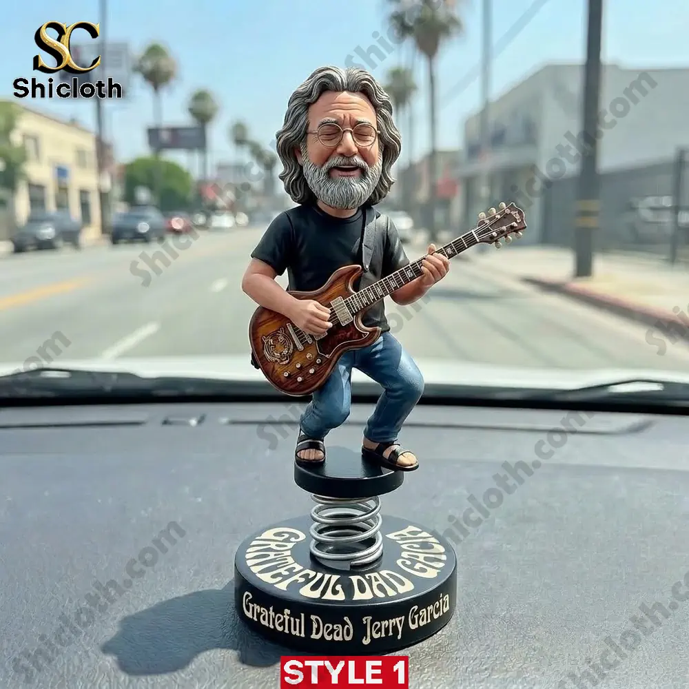 Jerry Garcia guitar bobblehead standing on car dashboard!