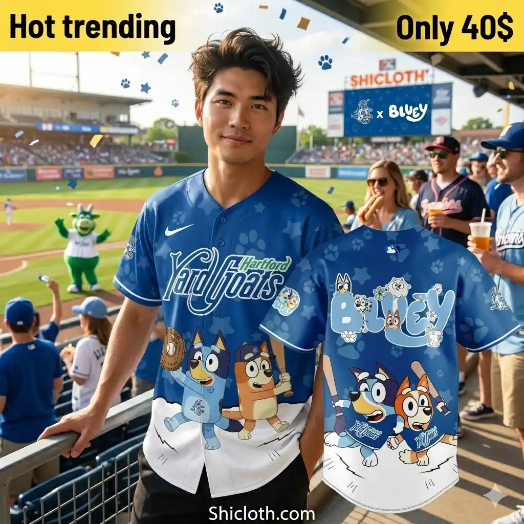 Man wearing blue cartoon baseball jersey at stadium!