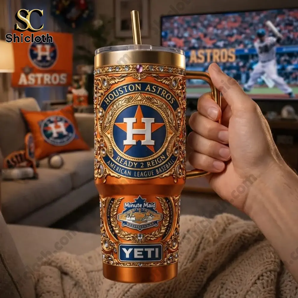 hand holding houston astros tumbler at home