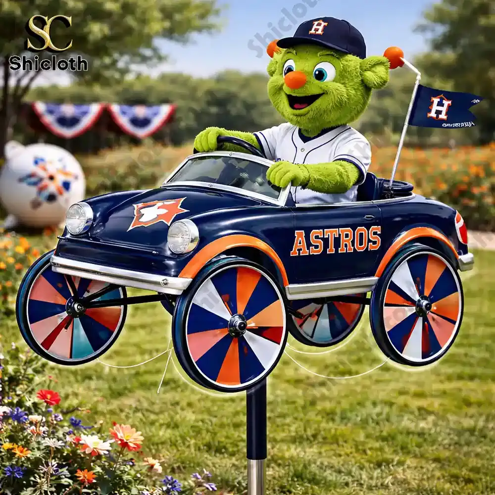 Green mascot driving Astros themed wind spinner car in garden
