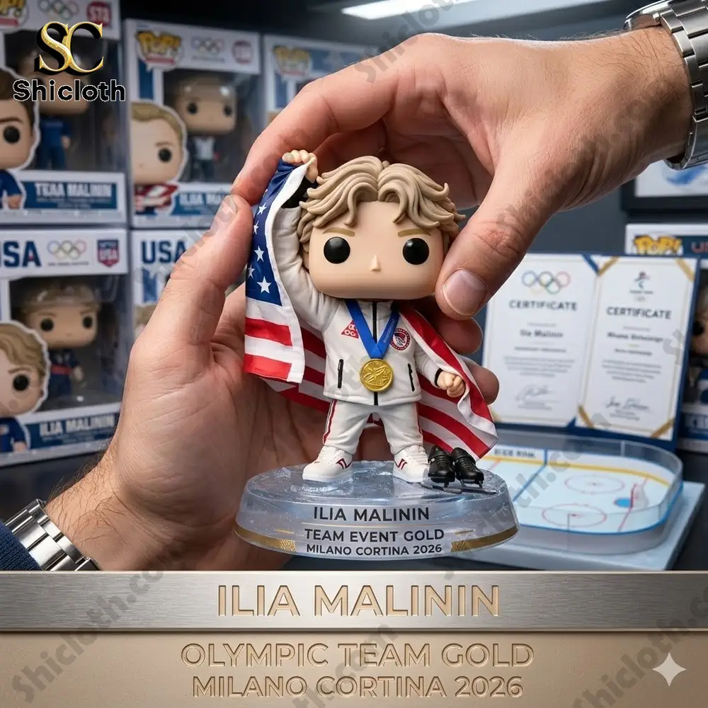A close-up of the Ilia Malinin Olympic Team Gold Milano Cortina 2026 Collector Edition Funko figure, with a certificate and a USA flag.