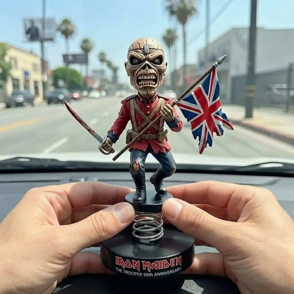 Hands holding Iron Maiden trooper Eddie bobblehead with british flag on dashboard!