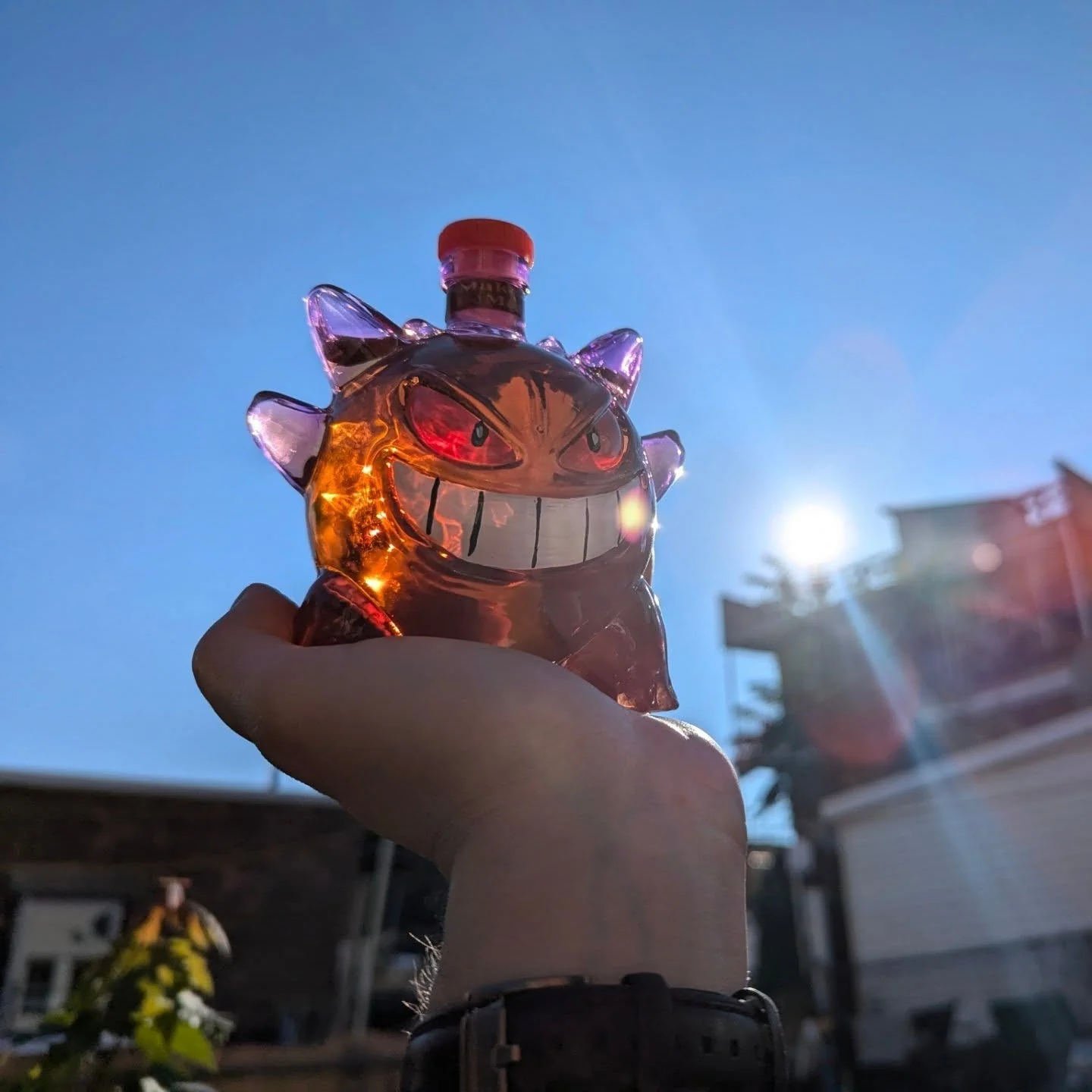 Jack Daniels Gengar Bottle 9 Small glowing Gengar whiskey bottle held in hand under sunlight by Shicloth!