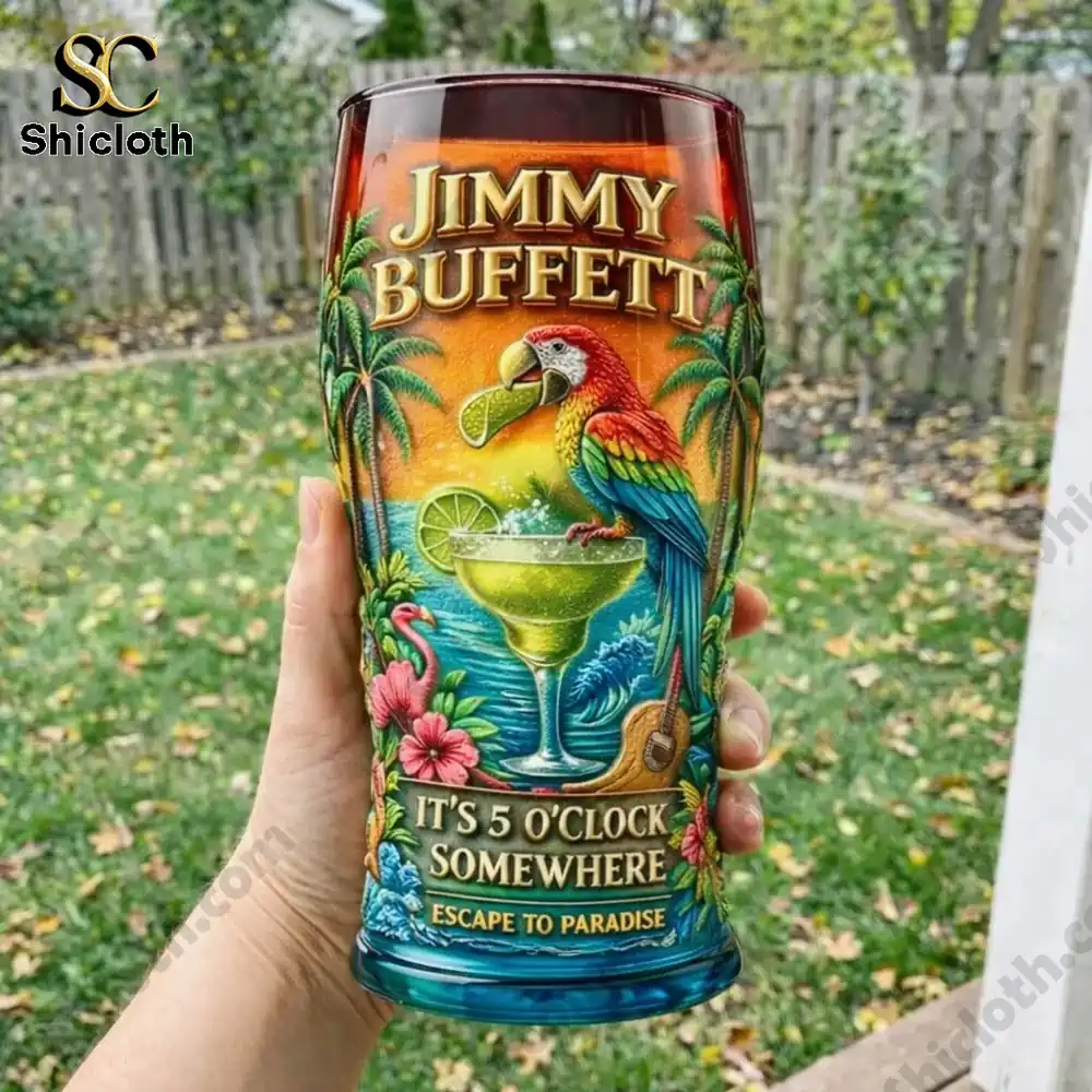 Hand holding tropical Jimmy Buffett glass with parrot and cocktail design!