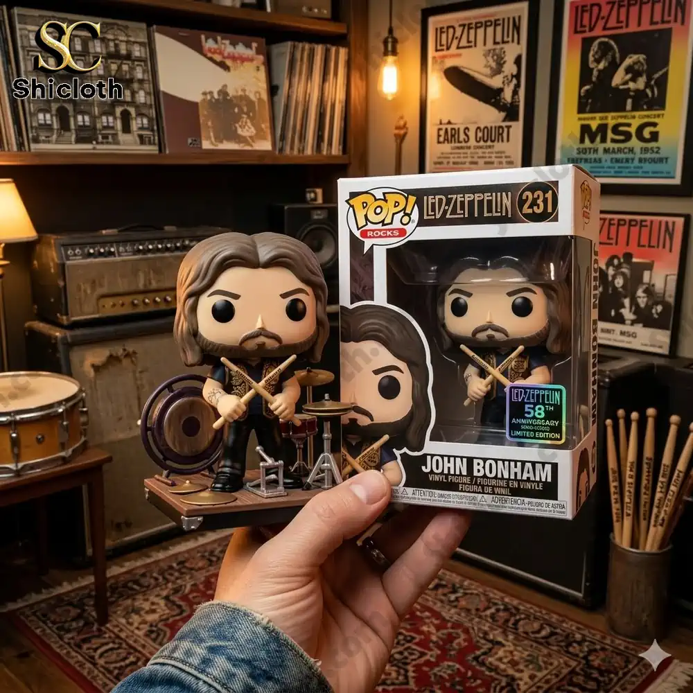 John Bonham vinyl figure with drum set displayed beside product box in a vintage music studio setting by Shicloth!