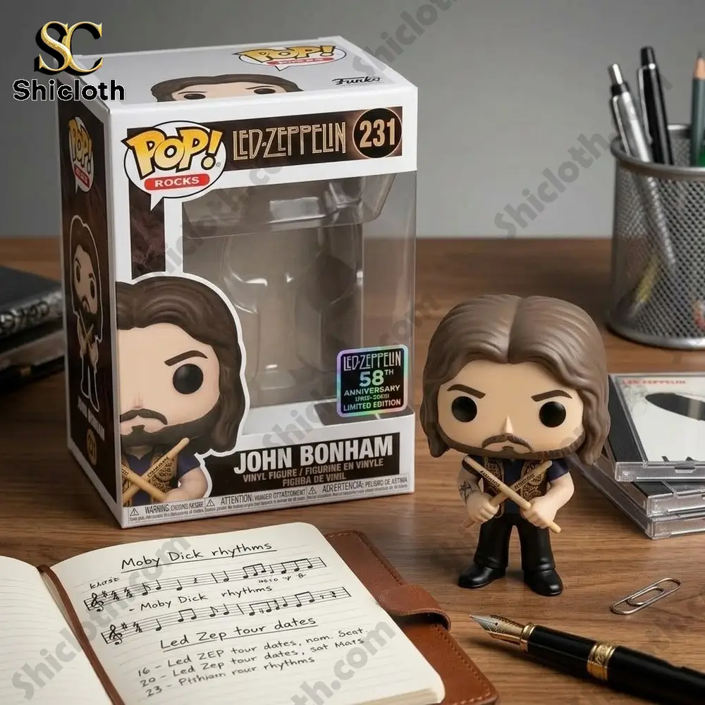 Led Zeppelin John Bonham 58th Anniversary Limited Edition Funko Pop Figure 4 John Bonham vinyl figure standing beside collectible box on a creative desk workspace by Shicloth!