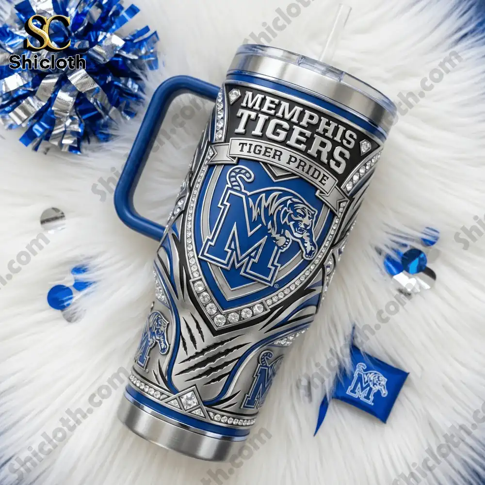 Memphis Tigers tumbler on soft white surface with cheer accessories!