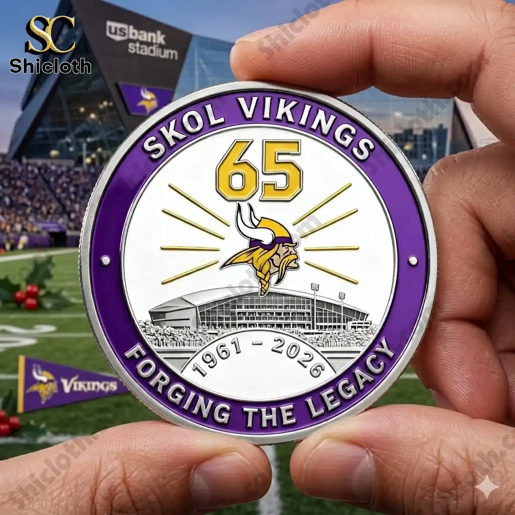 Minnesota Vikings 65th anniversary commemorative coin held in hand at stadium background