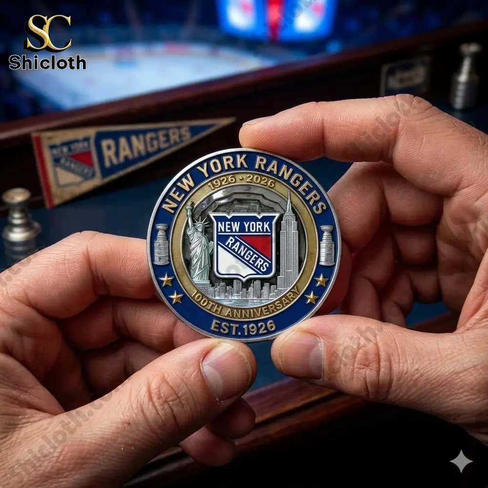 New York Rangers one hundredth anniversary commemorative coin held in hands showing team logo and New York skyline!