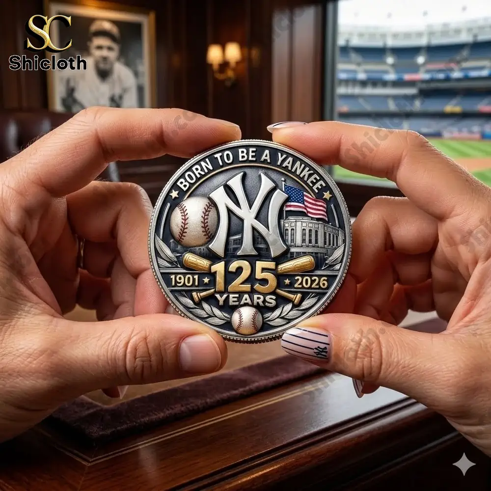 hands holding yankees commemorative coin in stadium view background!