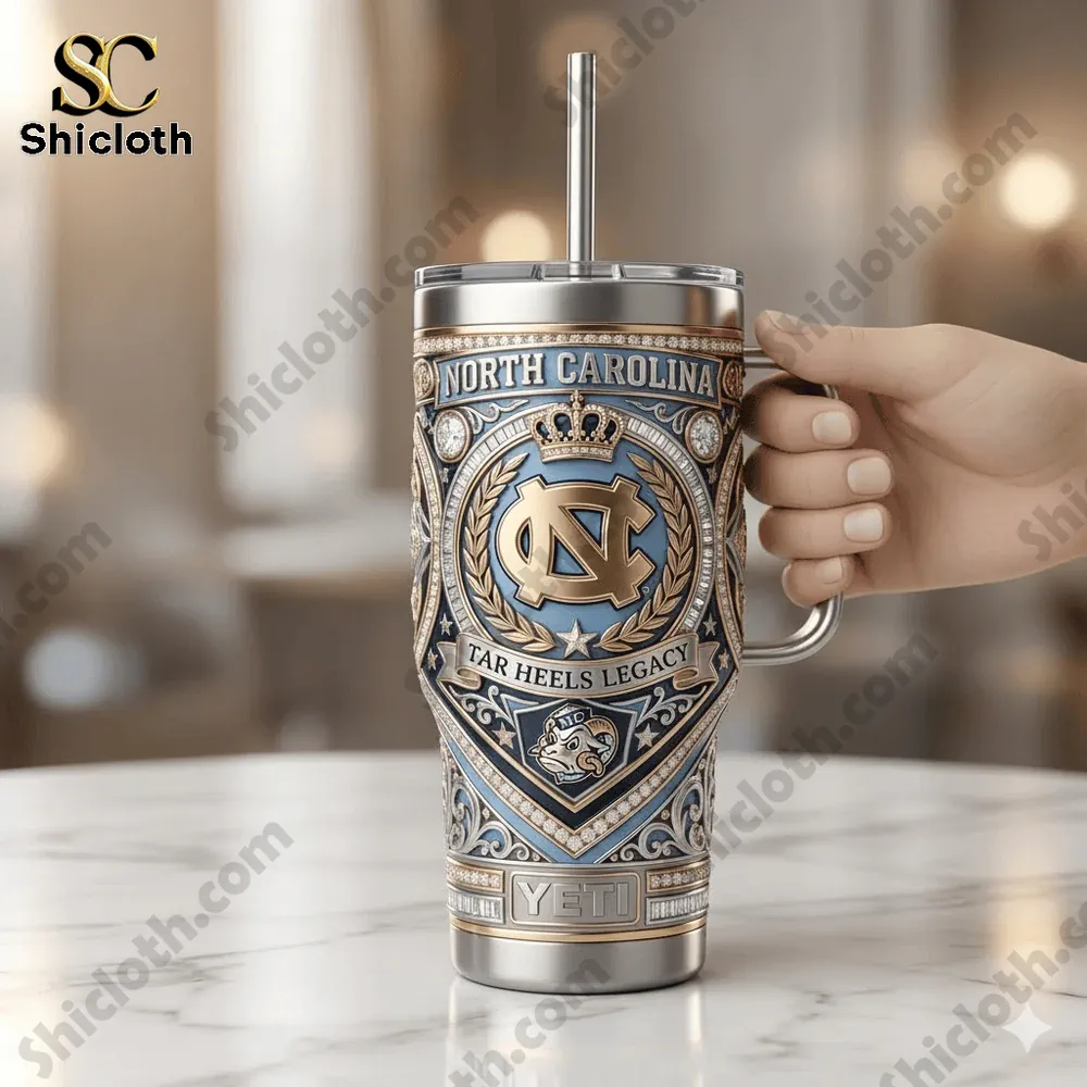 Luxury North Carolina Tar Heels tumbler with handle and straw held by hand