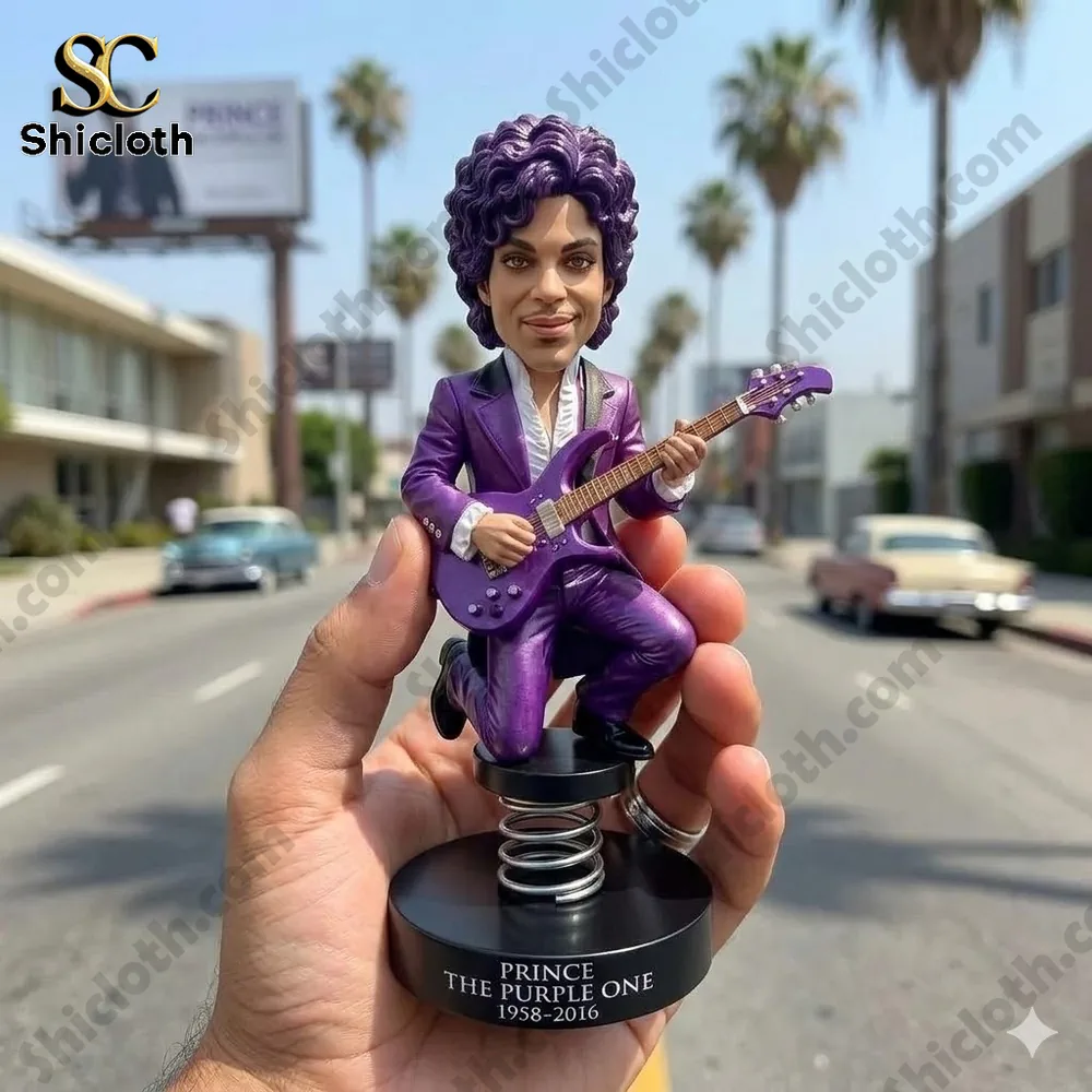 purple guitar player bobblehead figure held in hand on sunny street with palm trees!