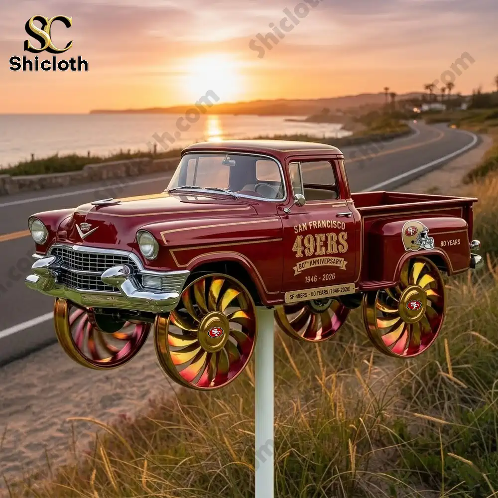 San Francisco 49ers truck wind spinner by coastal road at sunset