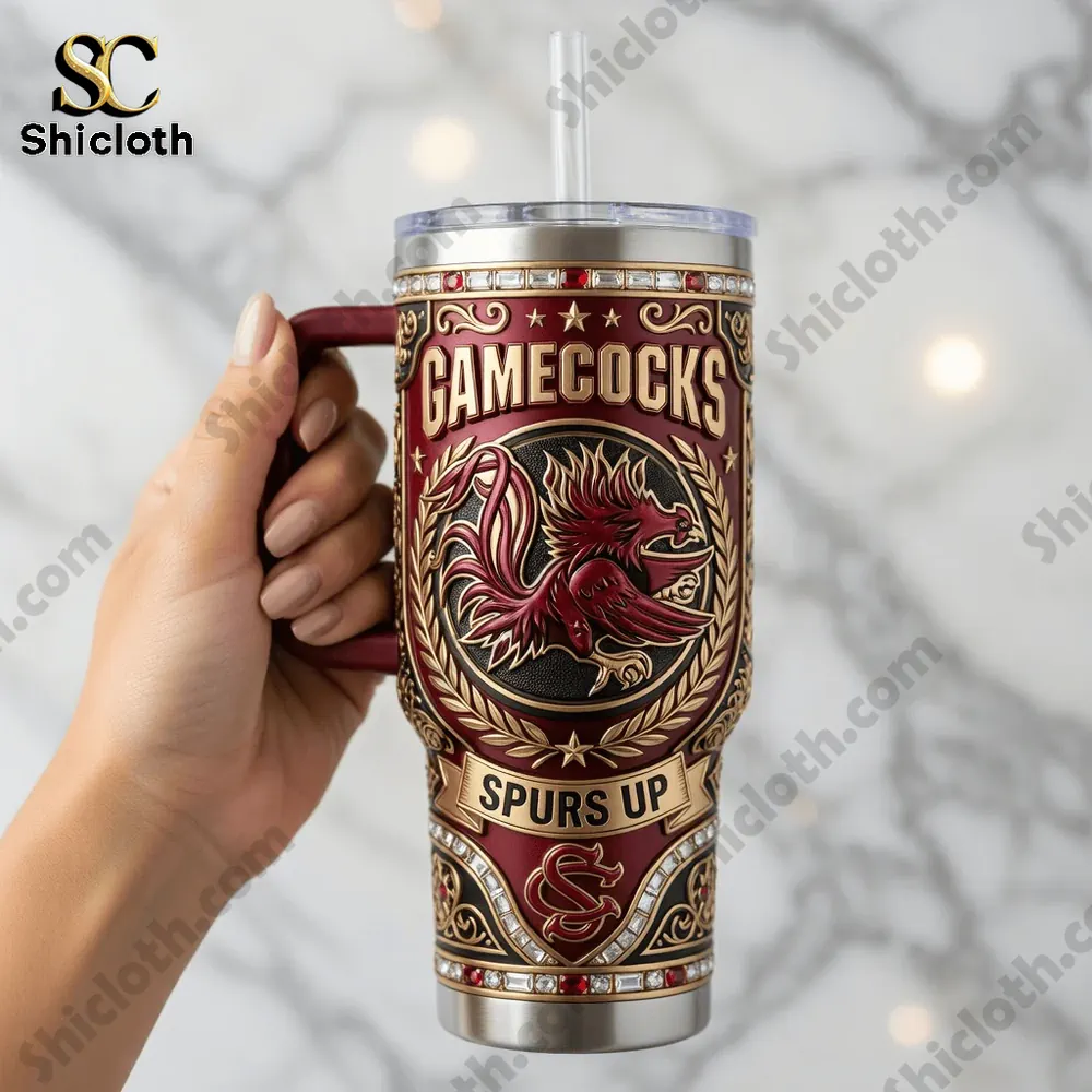 Hand holding Gamecocks tumbler with detailed red and gold design!