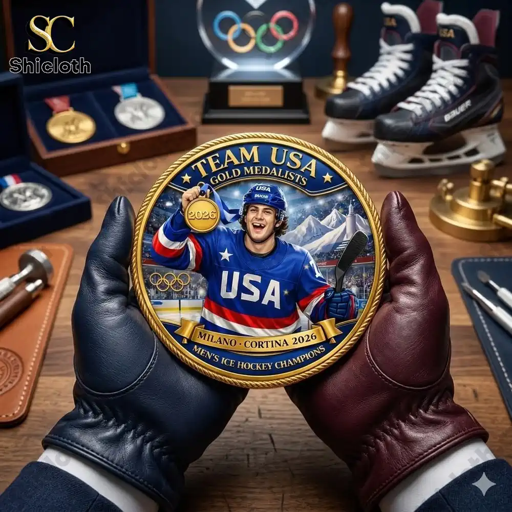 Hands holding Team USA hockey gold medal commemorative coin on sports display desk!