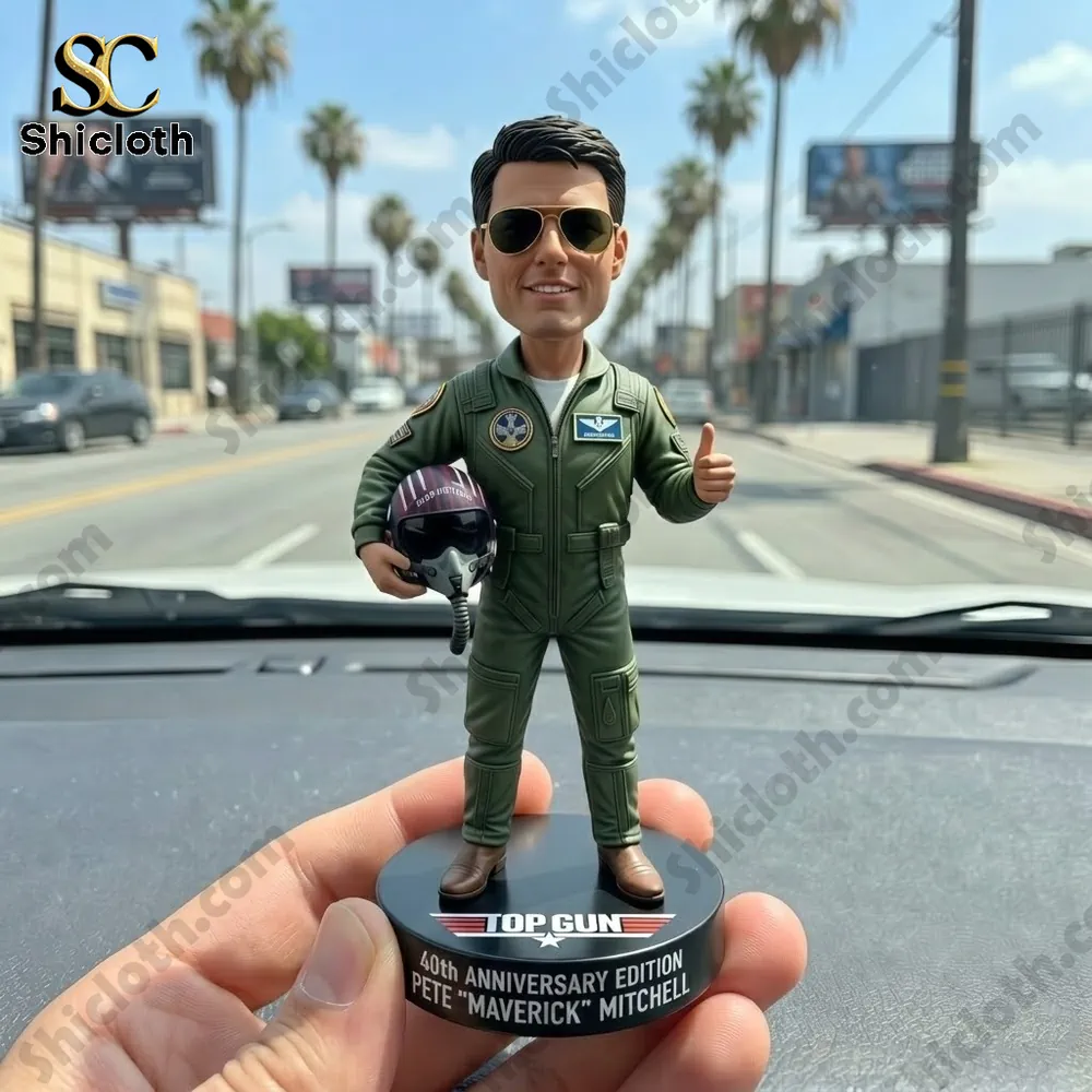 Pete Maverick Mitchell pilot figure holding helmet displayed on car dashboard!