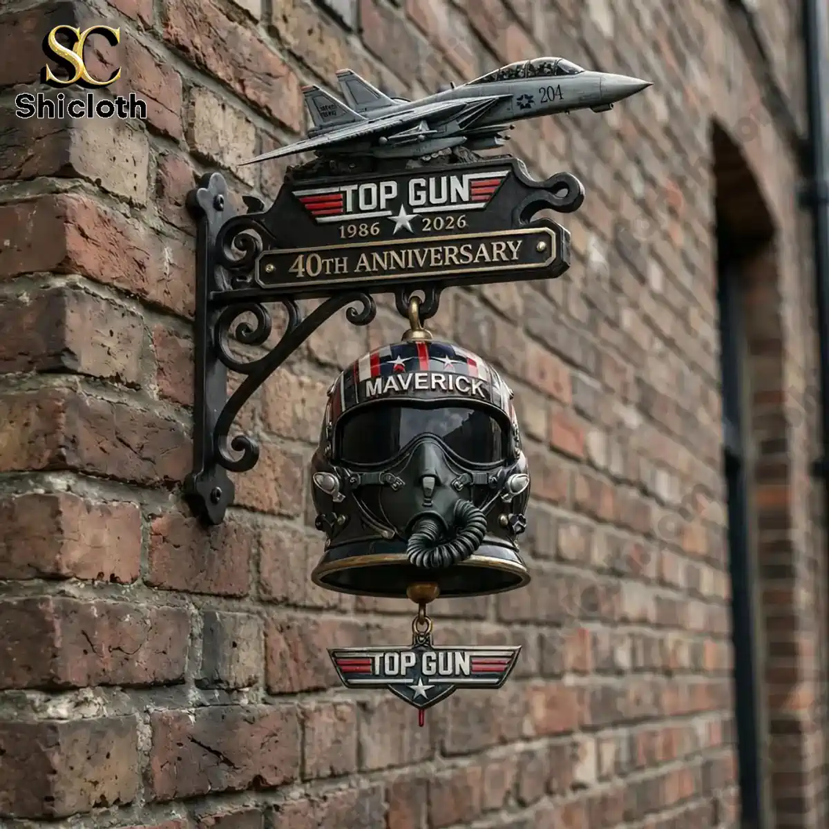 Top Gun 40th Anniversary Maverick wall bell mounted on brick wall.