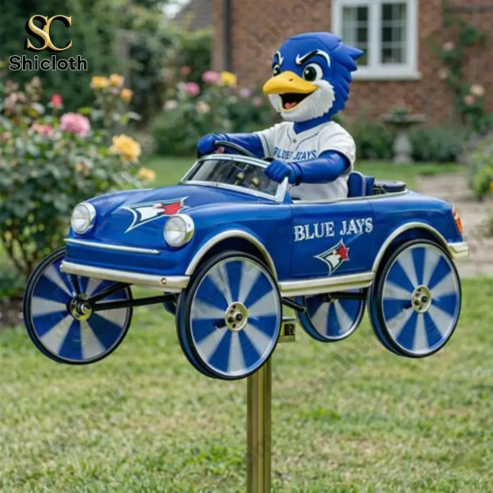Blue jay mascot driving blue car wind spinner in garden