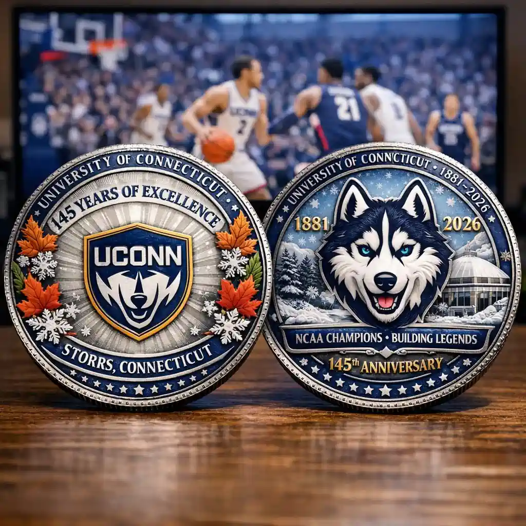Uconn Huskies commemorative coin showing front and back design on wooden table!