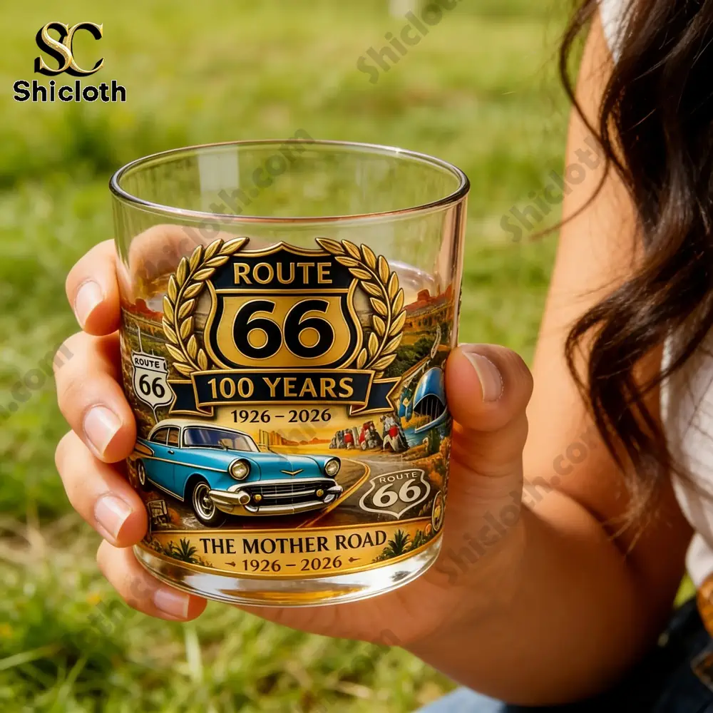 U.S. Route 66 Centennial Commemorative Whiskey Glass 4 Hand holding Route 66 whiskey glass outdoors in sunlight