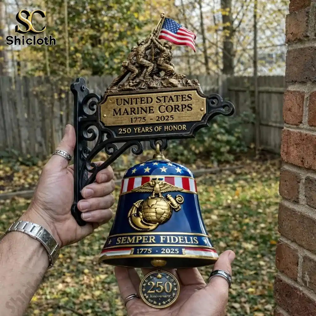 Hand holding US Marine Corps commemorative bell with American flag and anniversary medallion!