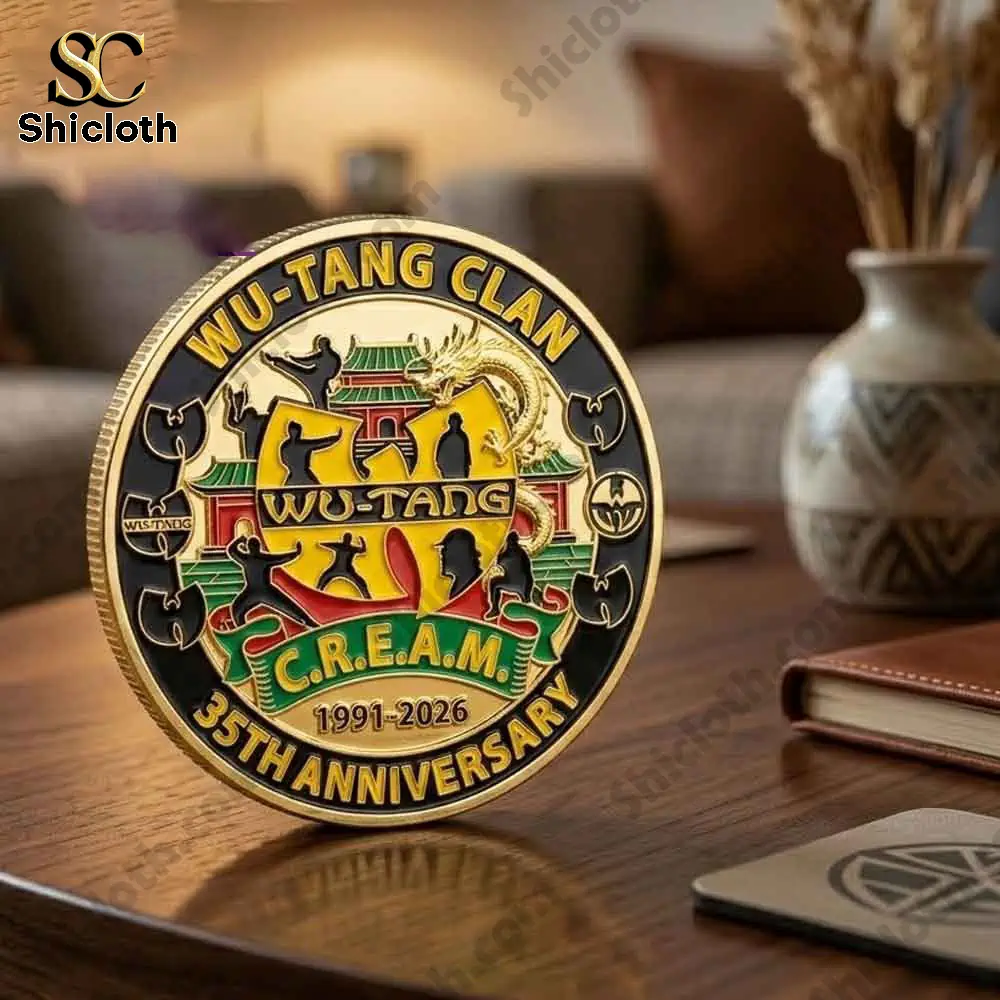 Wu Tang Clan thirty five anniversary cream gold enamel coin standing on desk