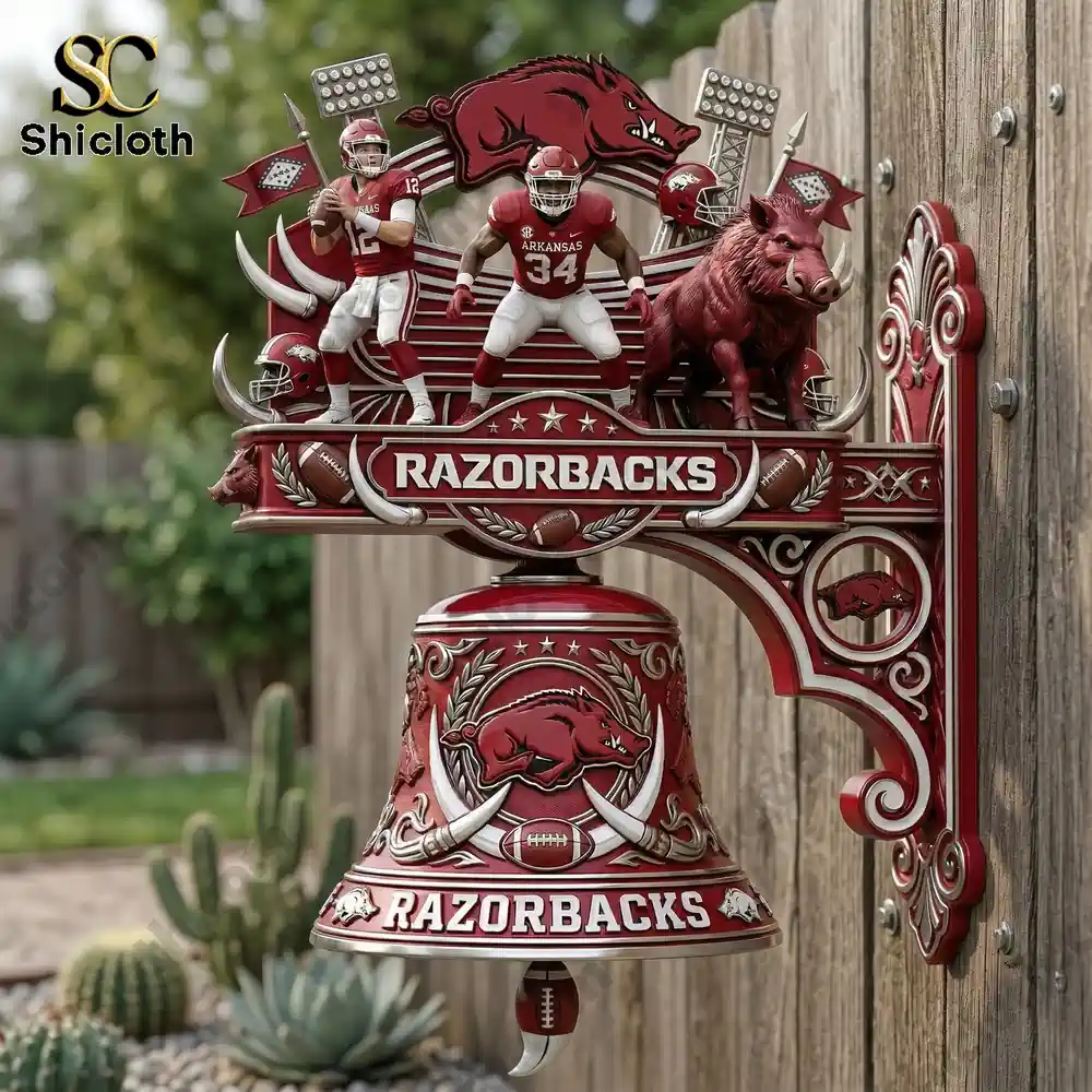 Guinness ESTD 1759 Commemorative Wall Bell 31 Arkansas Razorbacks wall bell mounted on wooden fence outdoors!