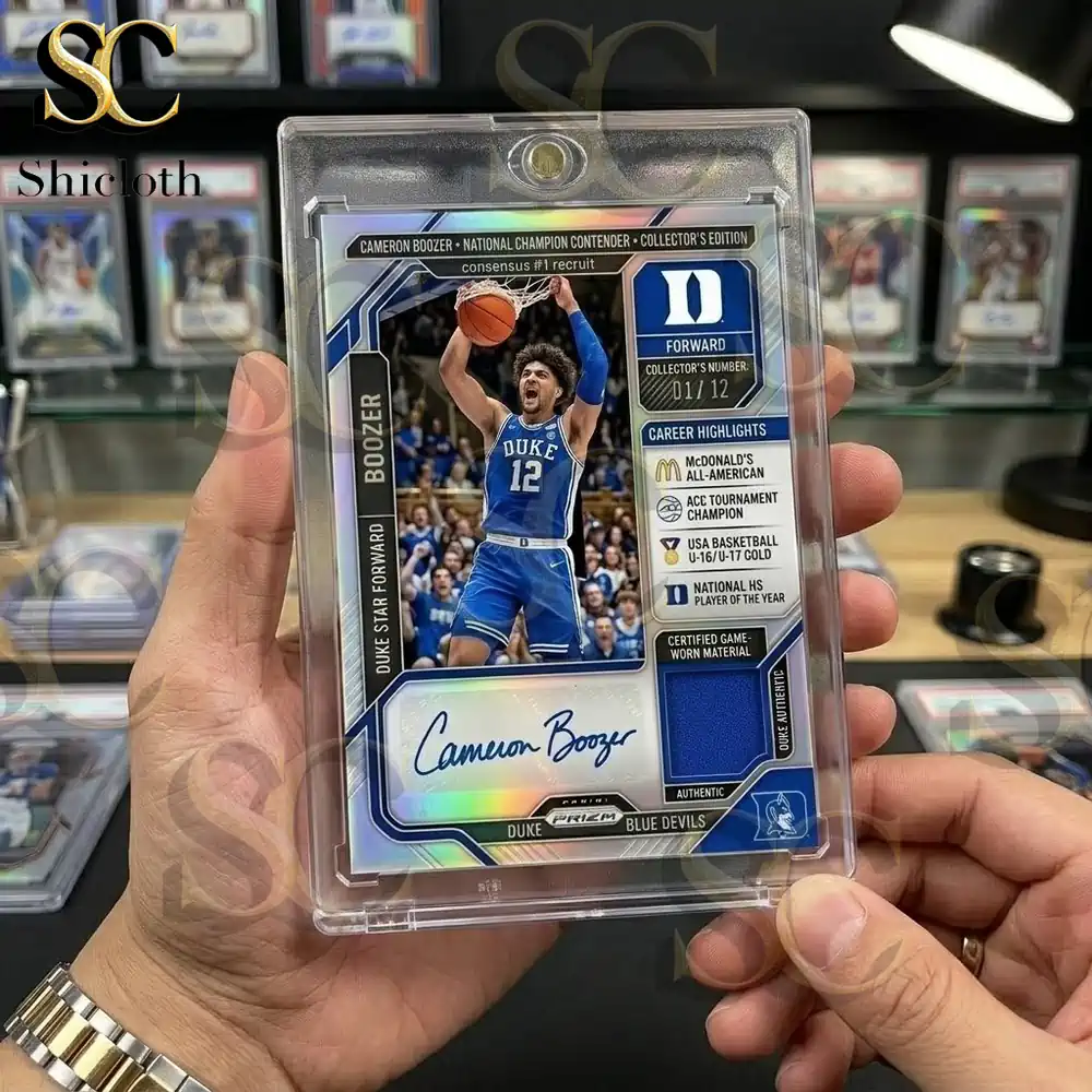 Person holds a clear magnetic card case containing a Cameron Boozer Duke Blue Devils basketball card with an autograph and patch.