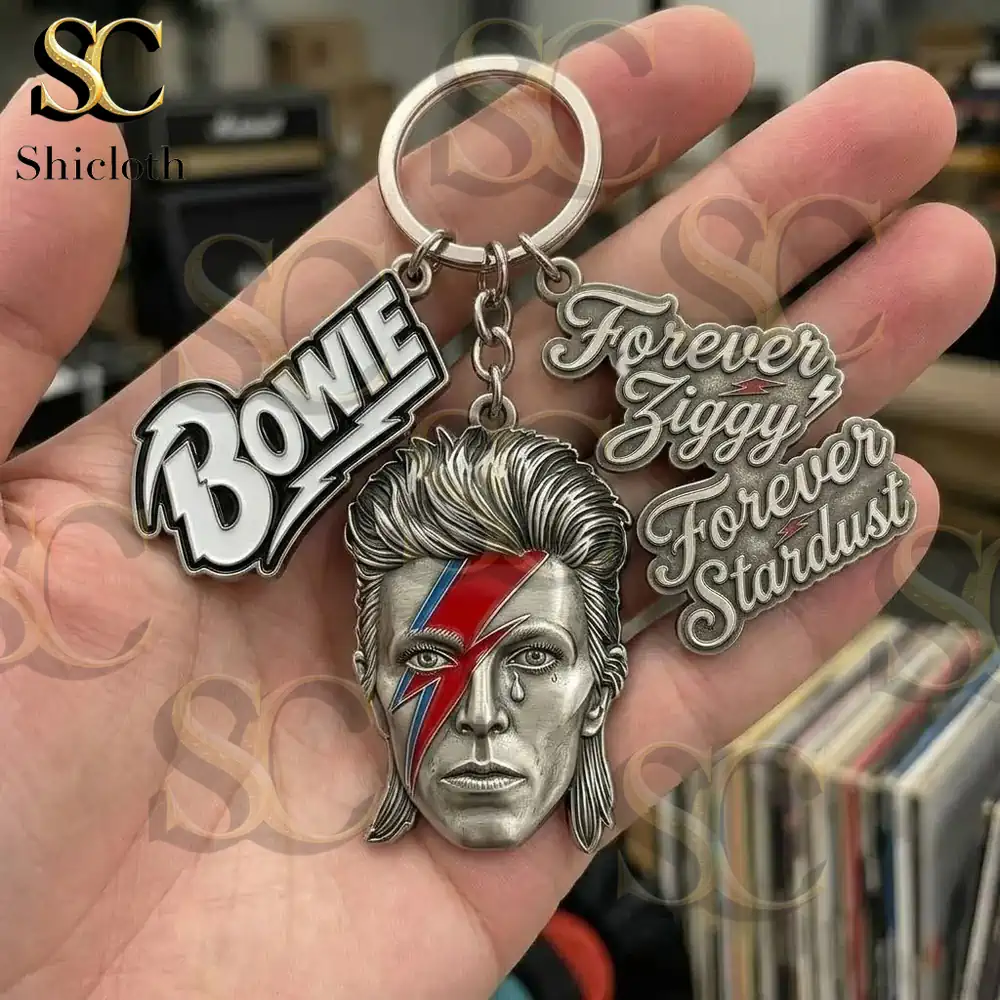 Close view of Bowie keychain in hand with music background!
