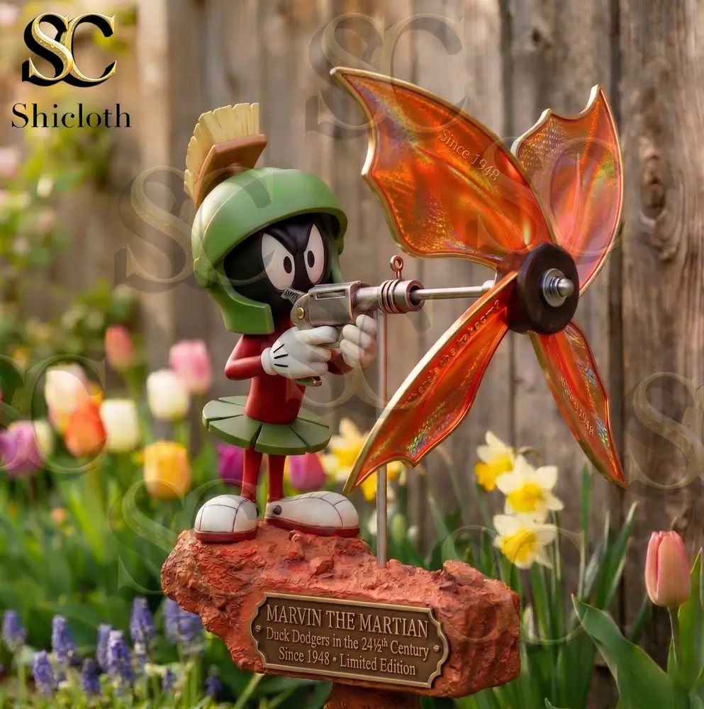 Marvin the Martian figure with orange wind spinner in garden!