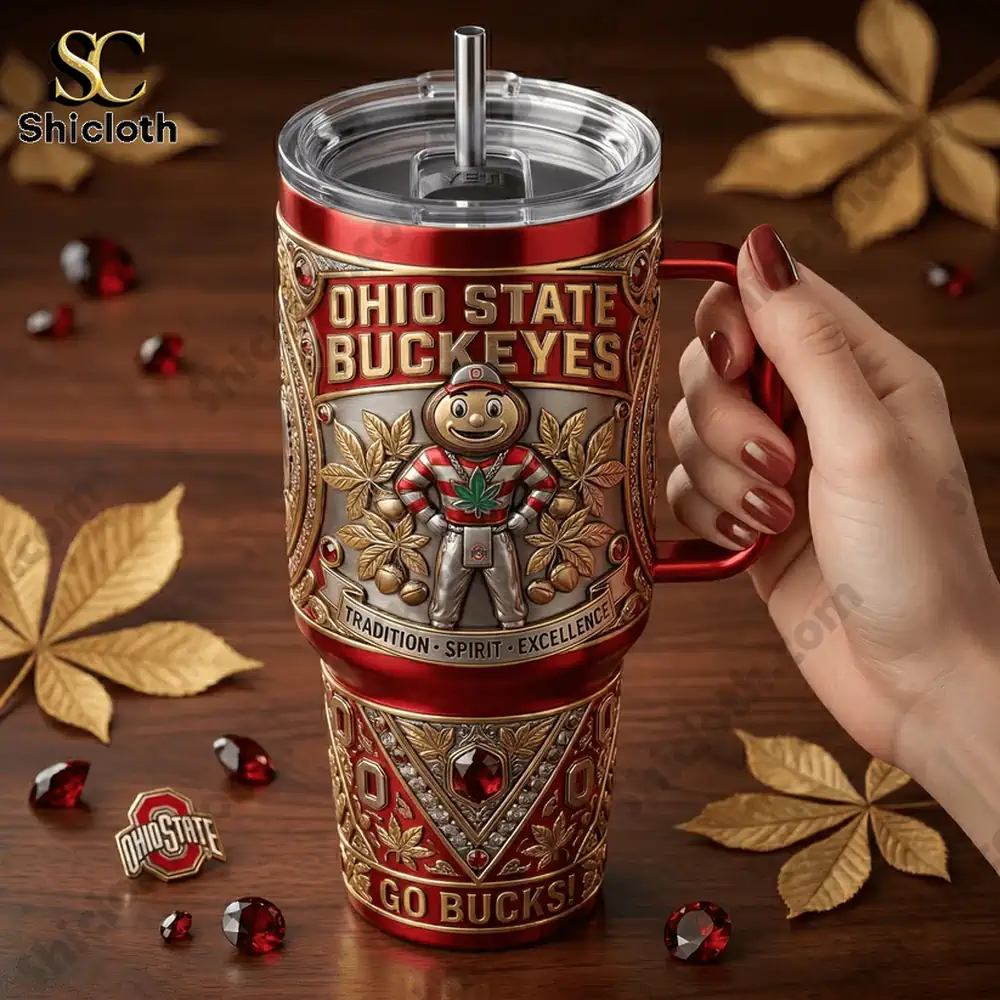 Ohio State Buckeyes Heritage 40oz Tumbler With Handle 3 Hand holding Ohio State Buckeyes tumbler on autumn background