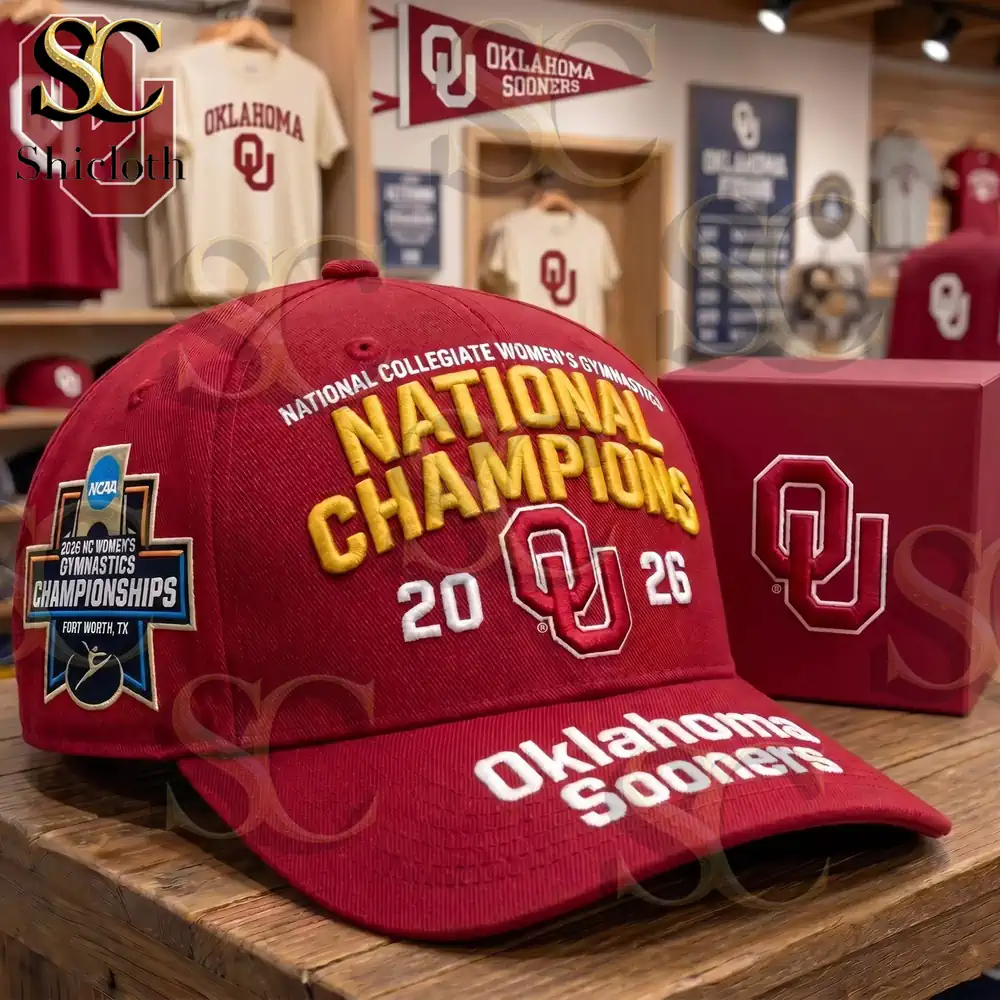 Red Oklahoma Sooners champions cap on wooden table