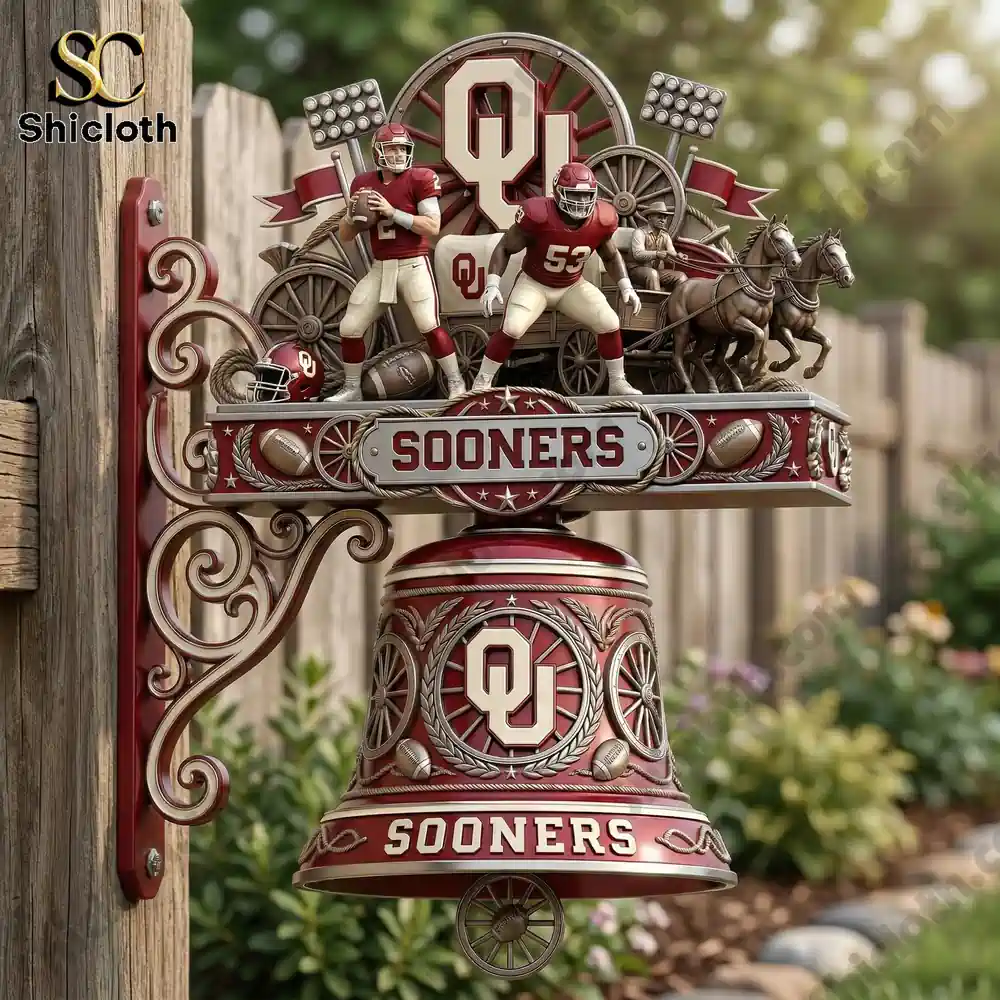 Oklahoma Sooners Premium Wall Bell 3 Sooners wall bell mounted on wooden fence in garden