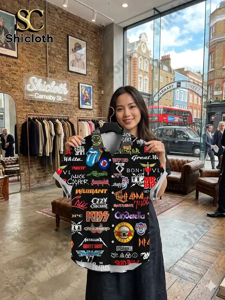 Woman holding rock band print shirt in clothing store!