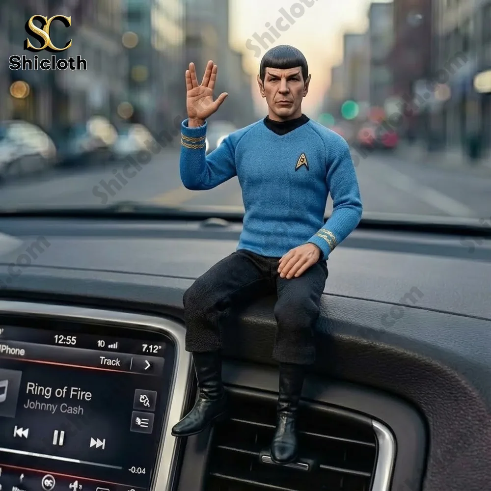 Spock figurine sitting on car dashboard