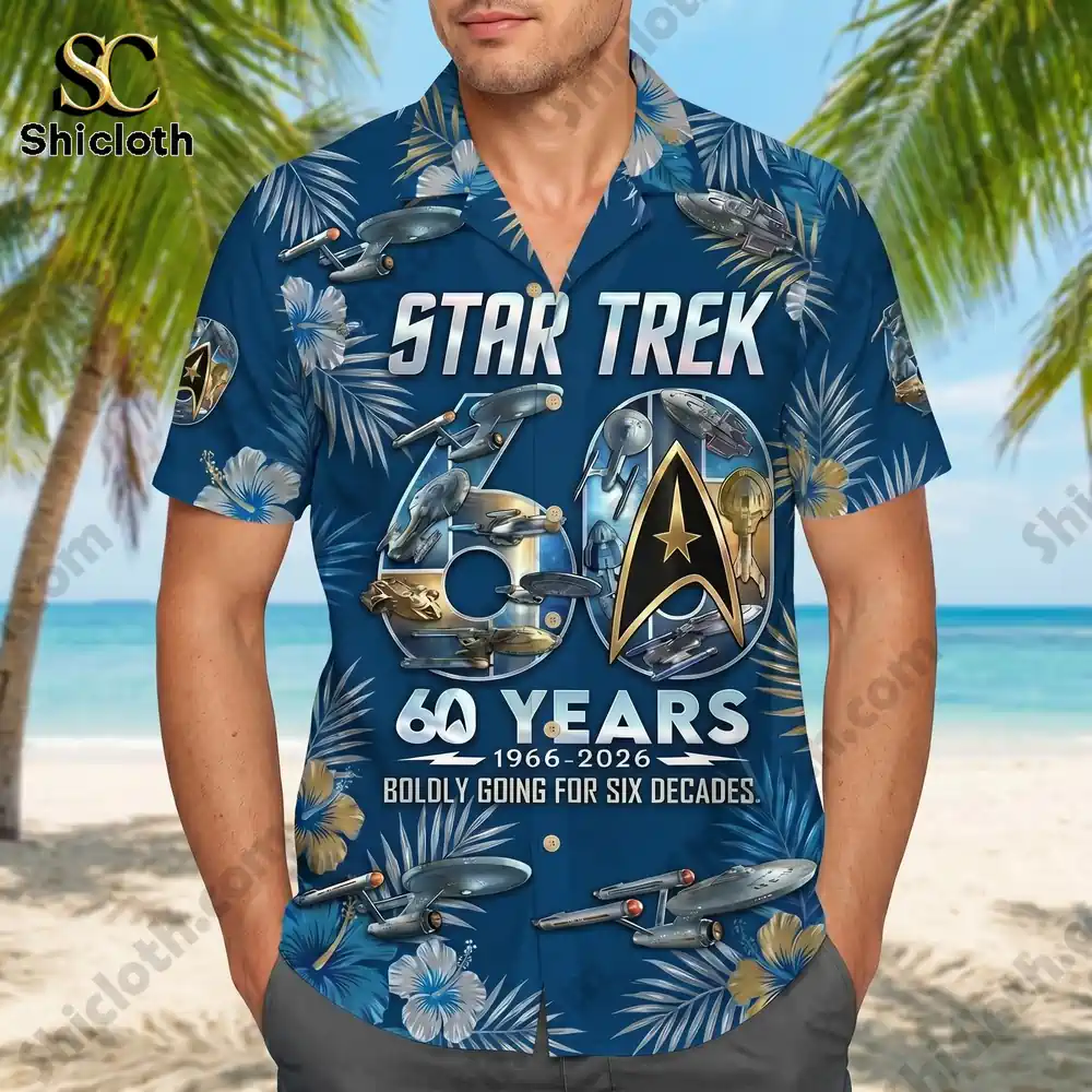 A man wearing a Star Trek 60 Years Shicloth Hawaiian shirt on a beach.