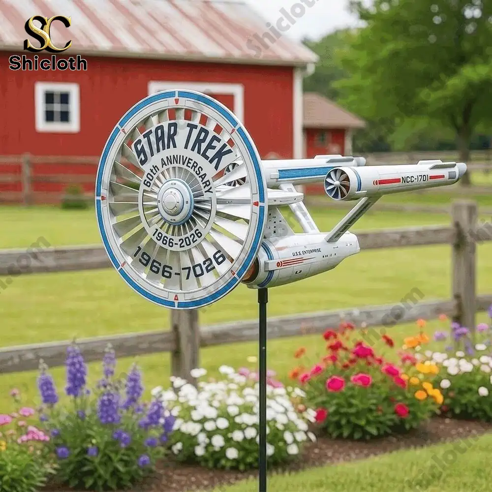 Star Trek wind spinner with spaceship design placed in colorful garden setting!