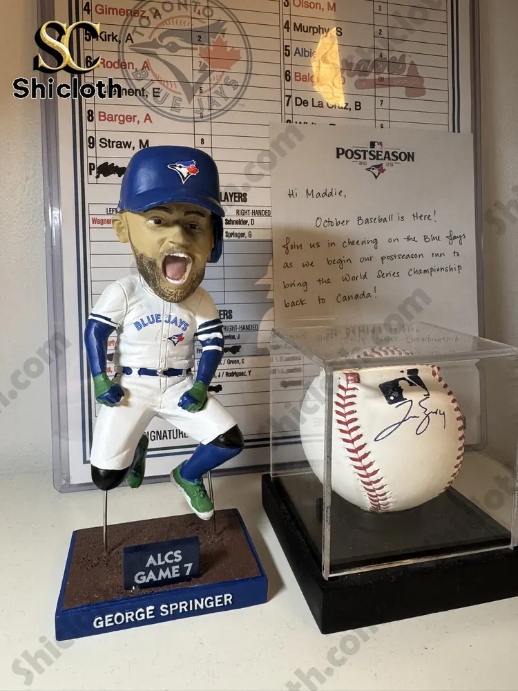 George Springer bobblehead beside signed baseball display