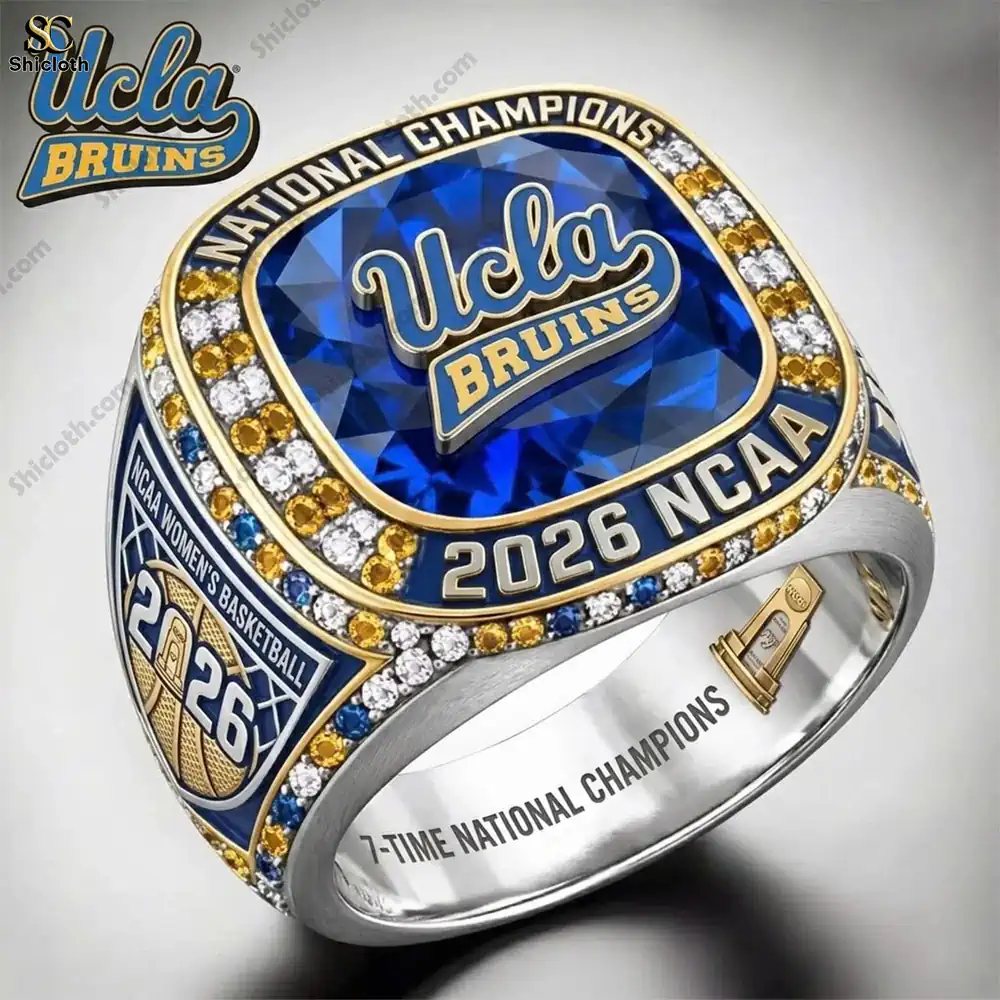 Close up of UCLA Bruins championship ring with blue gemstone and detailed design!