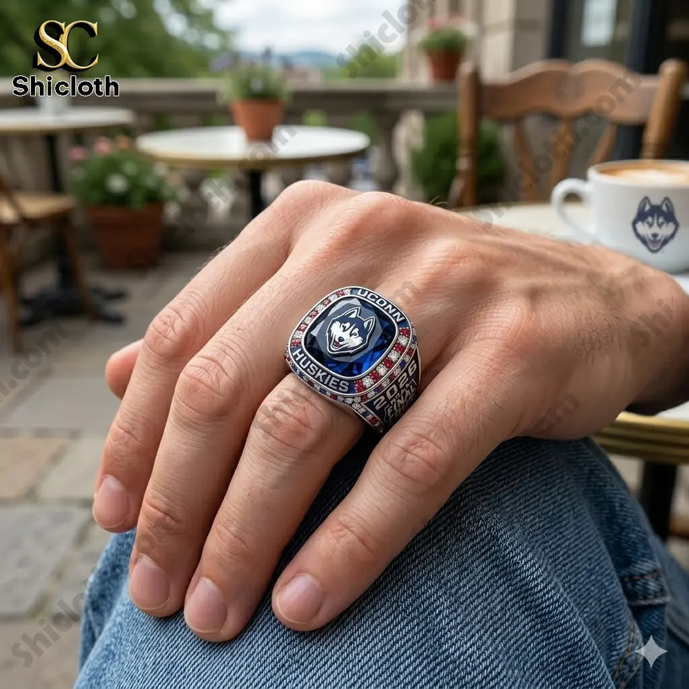 Hand wearing Uconn Huskies championship ring outdoors!