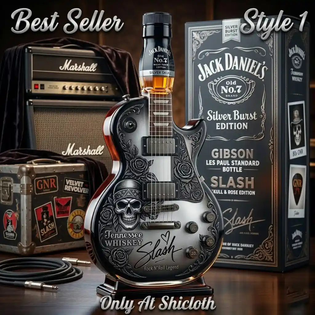 Silver Burst edition guitar shaped whiskey bottle with skull and rose engravings next to a Marshall amp.