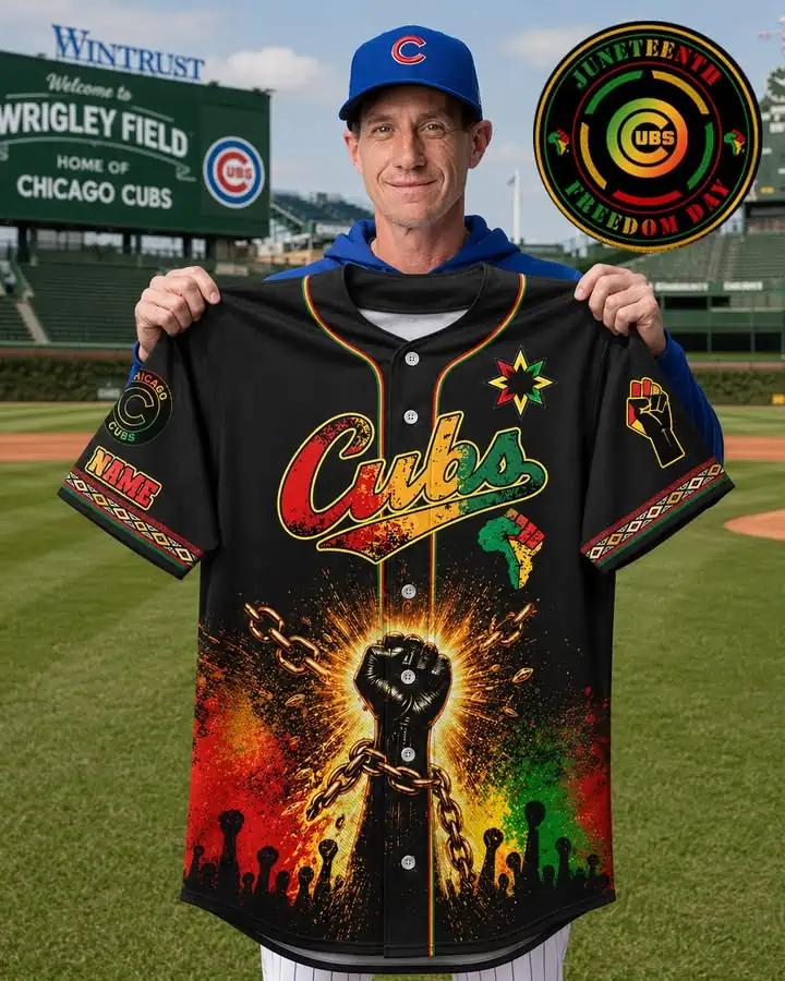 Man holding a Chicago Cubs Juneteenth Freedom Day jersey at Wrigley Field