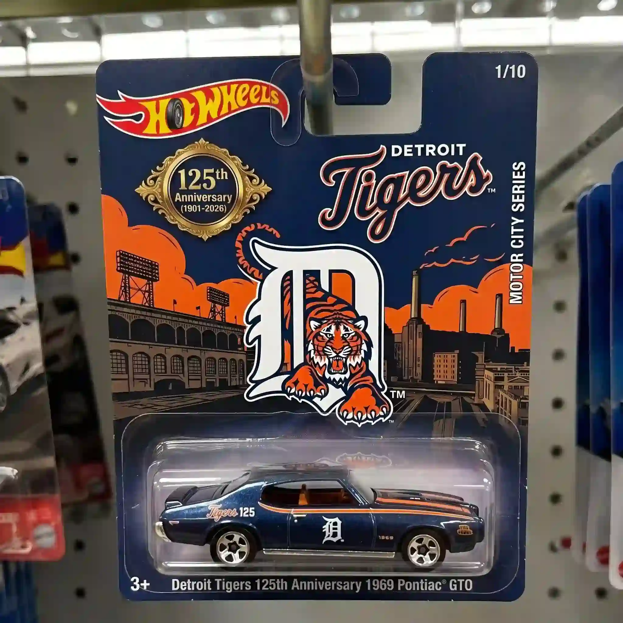 Close-up view of Detroit Tigers 125th Anniversary 1969 Pontiac GTO packaging showing logo and anniversary badge