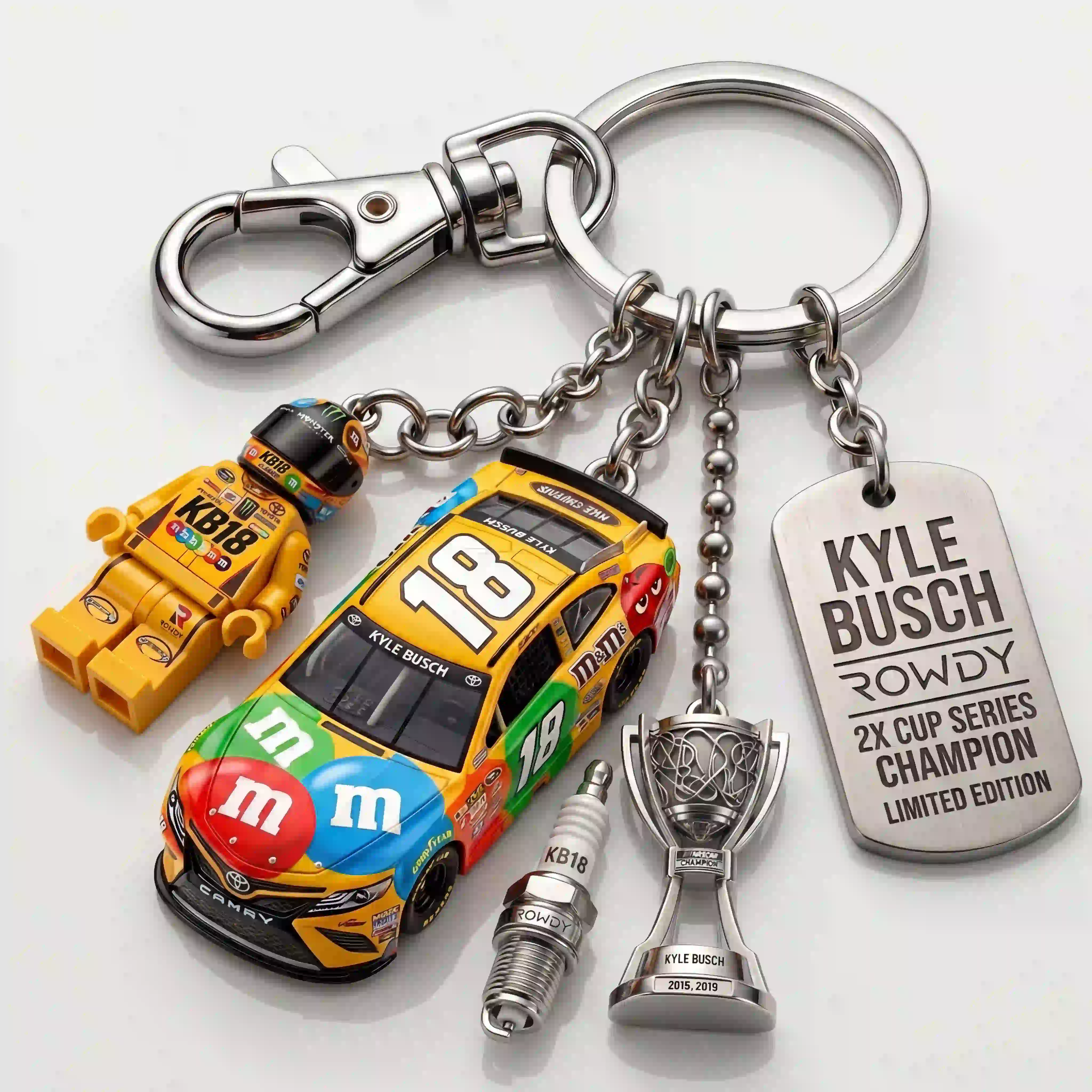 Kyle Busch “Rowdy” #18 M&M’s Championship Collector Keychain Set 4 Kyle Busch collectible keychain featuring car, figurine, trophy, and spark plug charms