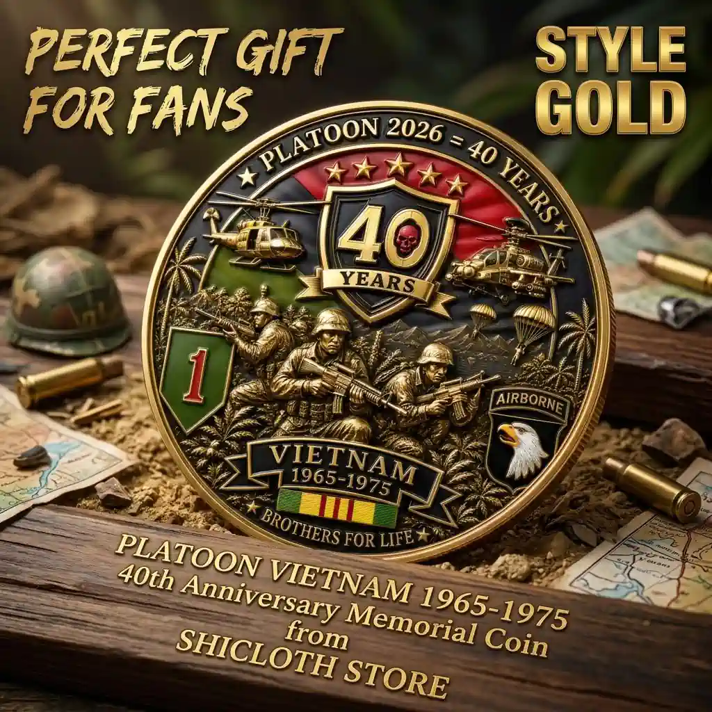 Gold Platoon Vietnam war memorial coin showing soldiers and helicopters on a rustic table
