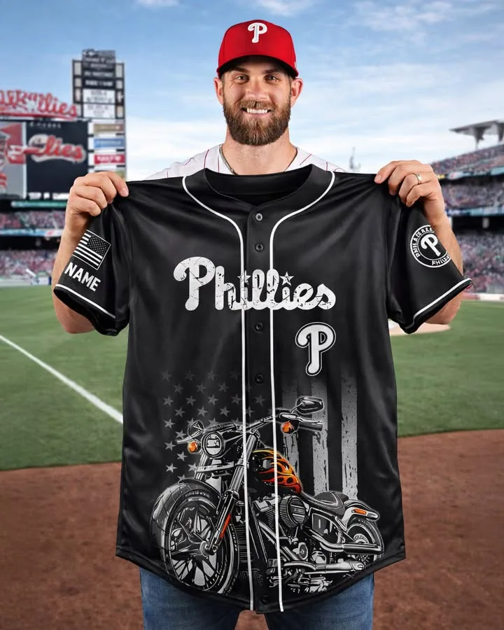 Man holding a custom Philadelphia Phillies black baseball jersey with motorcycle graphic